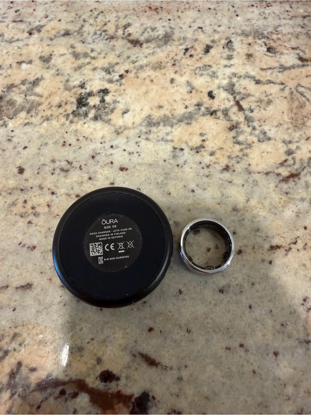 Oura Smart Ring in Polished Silver with Black Charging Dock